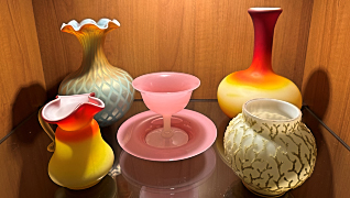 A picture of books on a shelf.